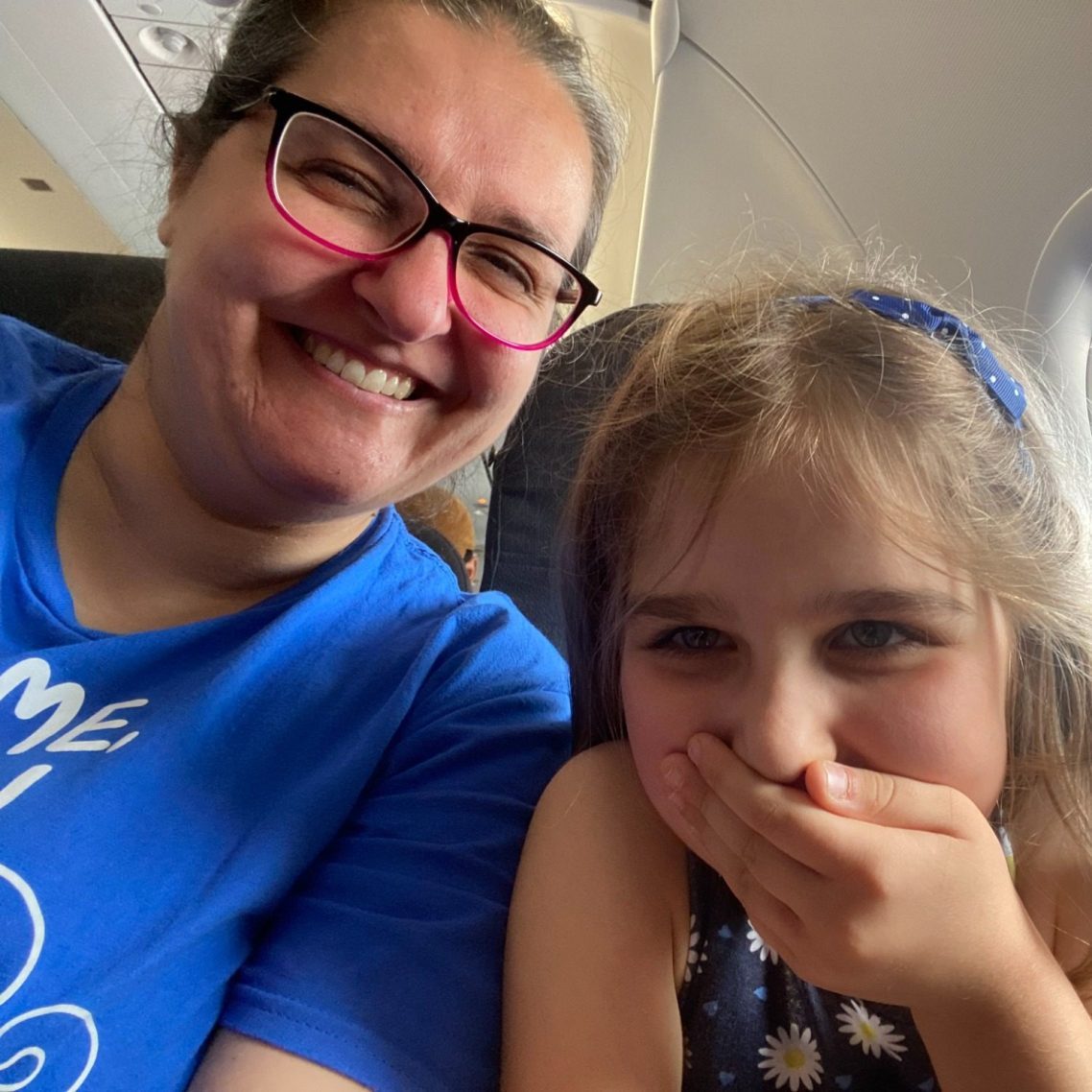 me (Chiara Briganti) and my daughter laughing on the plane