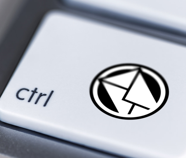 Close-up of a keyboard key featuring a "ctrl" label and an email inbox design.